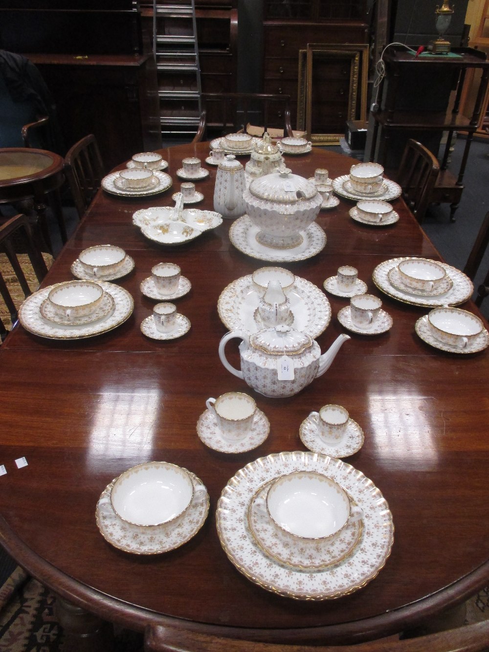 An extensive Spode dinner service, Fleur de Lys Gold pattern, decorated in gilt on an ivory ground