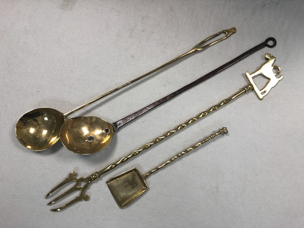 A 19th century decorative brass and iron cream skimmer, together with a pair of slender brass - Image 2 of 7