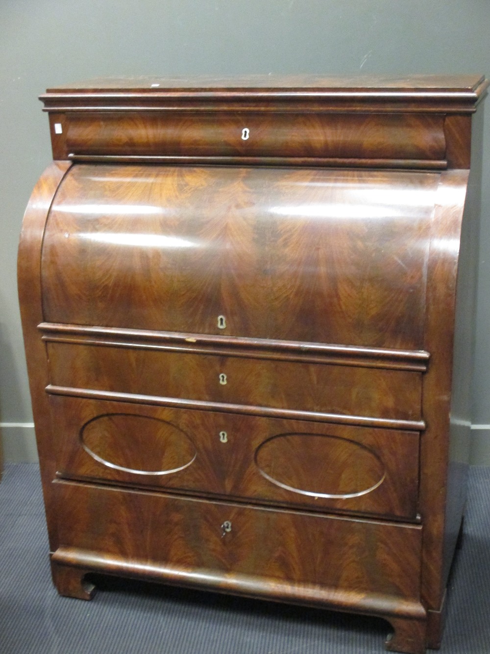 A 19th century Continental mahogany cylinder front bureau, 132 x 107 x 57cm