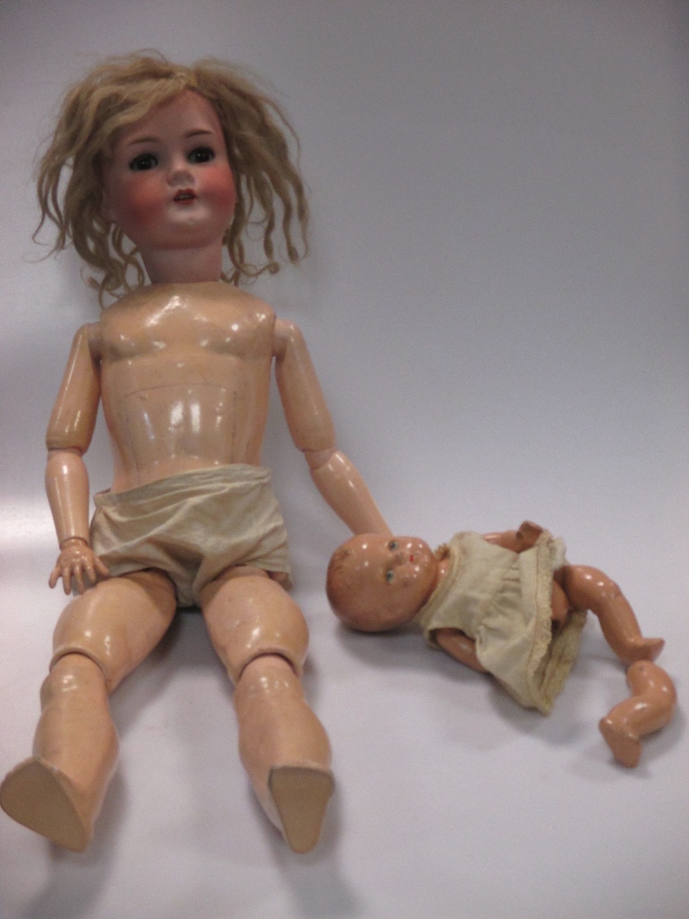 Three bisque head dolls and a composition head baby doll (4) - Image 2 of 4