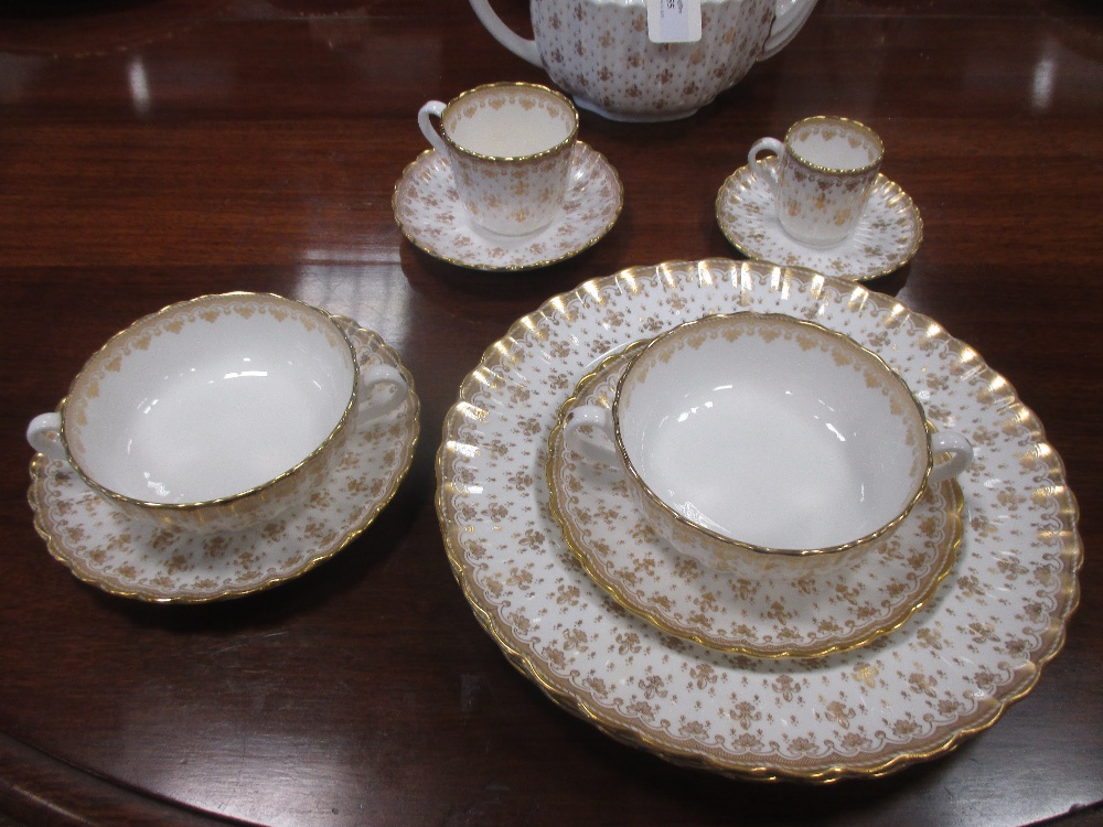 An extensive Spode dinner service, Fleur de Lys Gold pattern, decorated in gilt on an ivory ground - Image 2 of 3