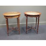 A pair of mahogany circular bijouterie tables, with boxwood line inlay on turned stretchered legs,