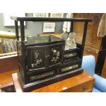 A Mid-20th century chinese black lacquer cabinet with stone relief decoration, together with a pair