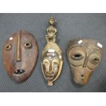 Tribal carvings and figures: 3 masks, stool, 2 figures etc (8)