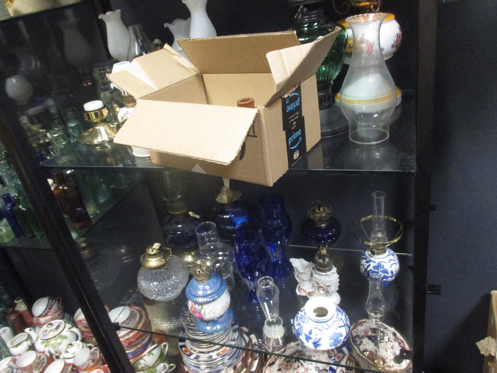 A very large quantity of glass bottles of varying sizes, salt glazed jars and various oil lamps - Image 9 of 11