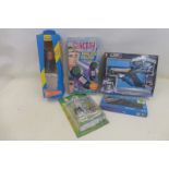 A boxed Pelham Puppets Thunderbirds figure, a boxed Stingray walkie talkie by Grandstand and a