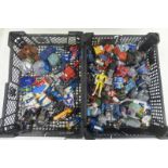 Two trays of miniature robots, models etc.