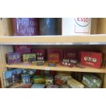 A shelf full of mostly OXO tins etc.