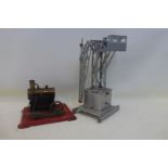 A clockwork tinplate model of a crane by Joustra, and a steam plant.