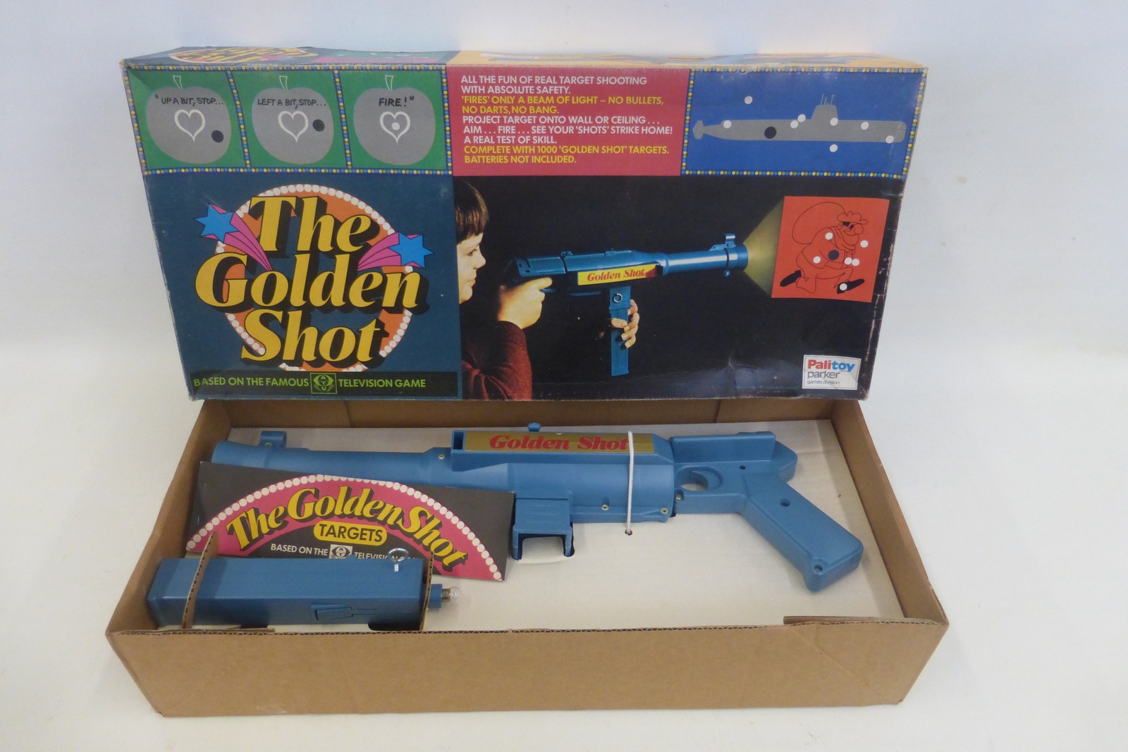 A boxed Palitoy 'The Golden Shot' toy gun.