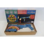 A boxed Palitoy 'The Golden Shot' toy gun.
