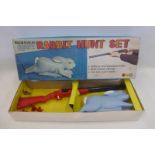 A boxed mechanical Rabbit Hunt set by Marx Toys.