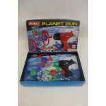 A boxed Merit Planet gun.