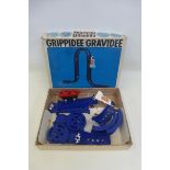 A boxed Grippidee Gravidee with one rocket car and eight accessories, made by Tomy.