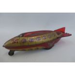 An unusual British tinplate friction operated spaceship by Wells Brimtoy.
