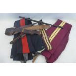 Two pairs of Kings Hussars trousers, a stable belt, a leather covered swagger stick and a Sam Browne