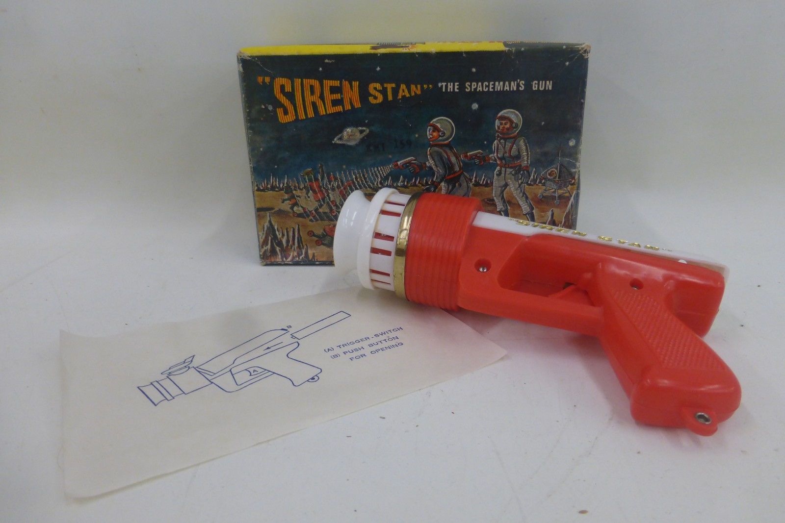 A boxed 'Siren Stan' The Spaceman's Gun, battery powered, made in the British Colony of Hong Kong.