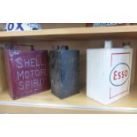 A Shell Motor Spirit two gallon petrol can, an Esso can and one other.