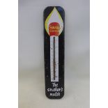 A Swan Vestas tin thermometer, 3 1/4 x 15".