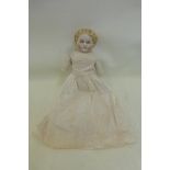 An early 20th Century bisque headed doll.