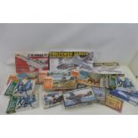 A box of Airfix and other boxed kits.