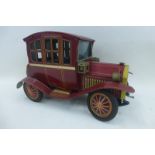 A tinplate model of an Edwardian motorcar by Nomura, Japan.