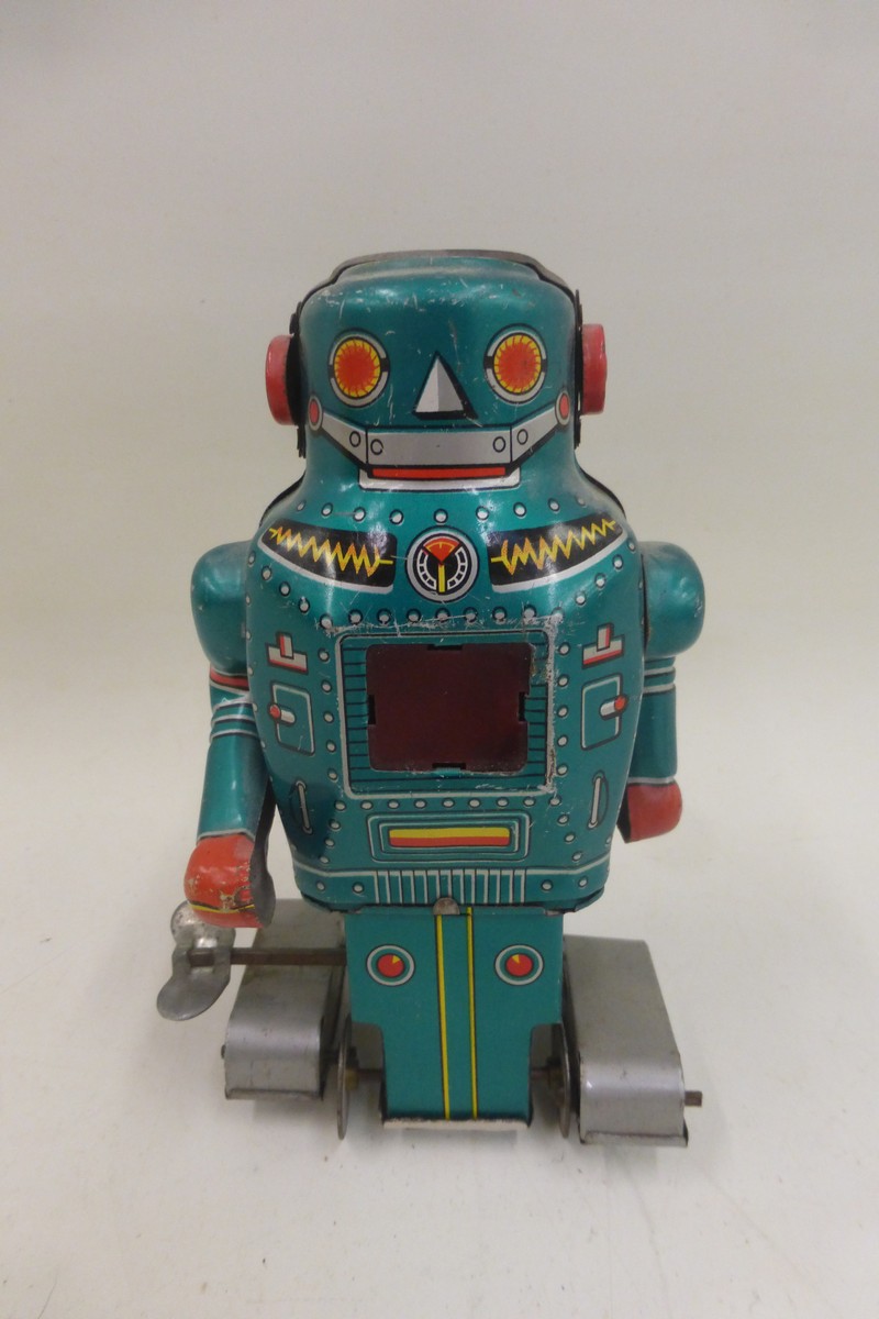 A Japanese tinplate clockwork Sparky Robot by Noguchi.