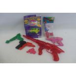 A selection of plastic toy guns.