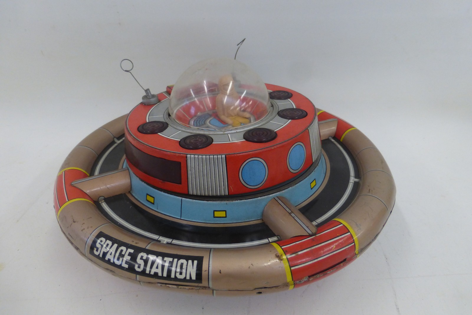 A Japanese tinplate Planet Y Space Station by Nomura.
