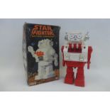 A boxed Star Fighter OR Starfighter battery operated robot, made in Hong Kong.