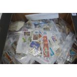 A box of loose stamps, sorted into bags, miniature stamps etc.