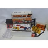 A boxed Scalextric 100 electric model racing set and accessories.