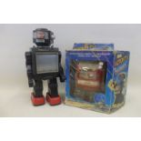 A boxed Chinese battery operated Action TV Robot and one other.