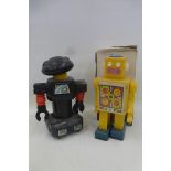 A boxed Russian robot and a Chinese robot.