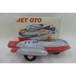 A boxed tinplate friction powered space rocket titled Jet Oto, stamped Turk Mali.