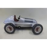 A Schuco clockwork tinplate model of a Mercedes Benz single seater racing car.