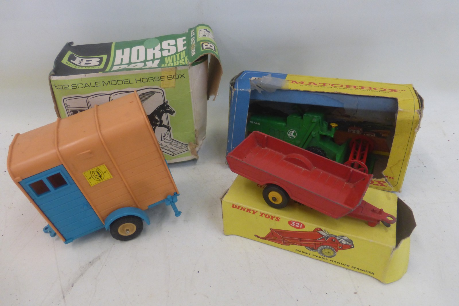 A boxed Matchbox King Size Combine Harvester, a boxed Britains Ltd. 1:32 scale Horse Box and a Dinky