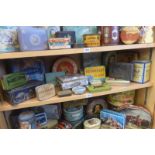 A shelf full of tins including Jacob's Biscuits.