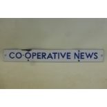 A Co-operative News rectangular enamel strip, with excellent gloss, 16 x 2".