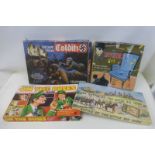 Four board games including 'The Invisible Man' and 'On the Buses'.