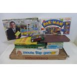A selection of board games including the mouse trap game; also jigsaw puzzles.