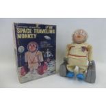 A boxed battery operated space travelling monkey, made in Japan by Yanoman Toys.