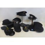 A quantity of assorted hats including Police, Railway and Fire.