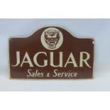 A reproduction Jaguar Sales & Service enamel sign, 27 x 17".