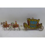 A British made tinplate model of the Coronation Coach.