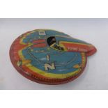 An English friction drive tinplate flying saucer.