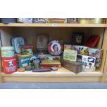 A shelf full of assorted tins.