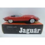 A boxed tinplate model of an E-type Jaguar convertible.