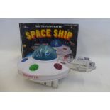A boxed battery operated spaceship, made in Hong Kong.