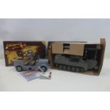 A boxed Indiana Jones Troop Car from Raiders of The Lost Ark and a boxed Indiana Jones Jungle